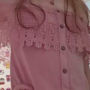 Over the shoulder pink shirt